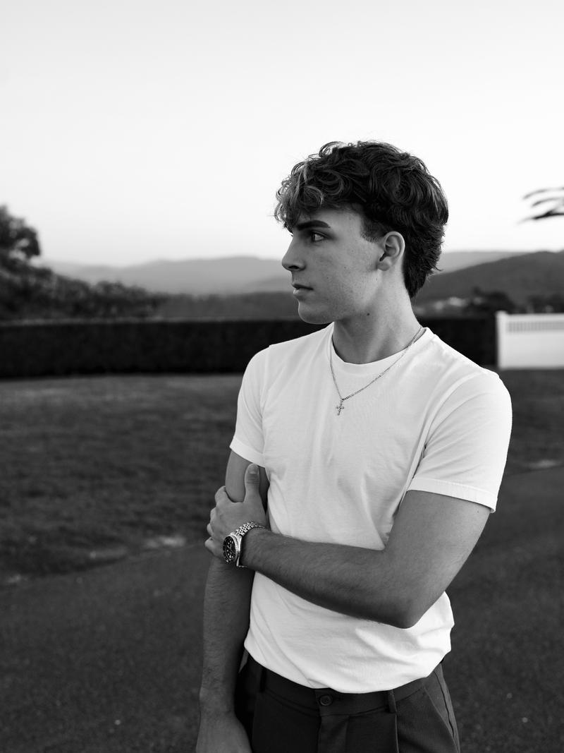 Houston Windle, founder of Windle, outdoors in a white T-shirt.